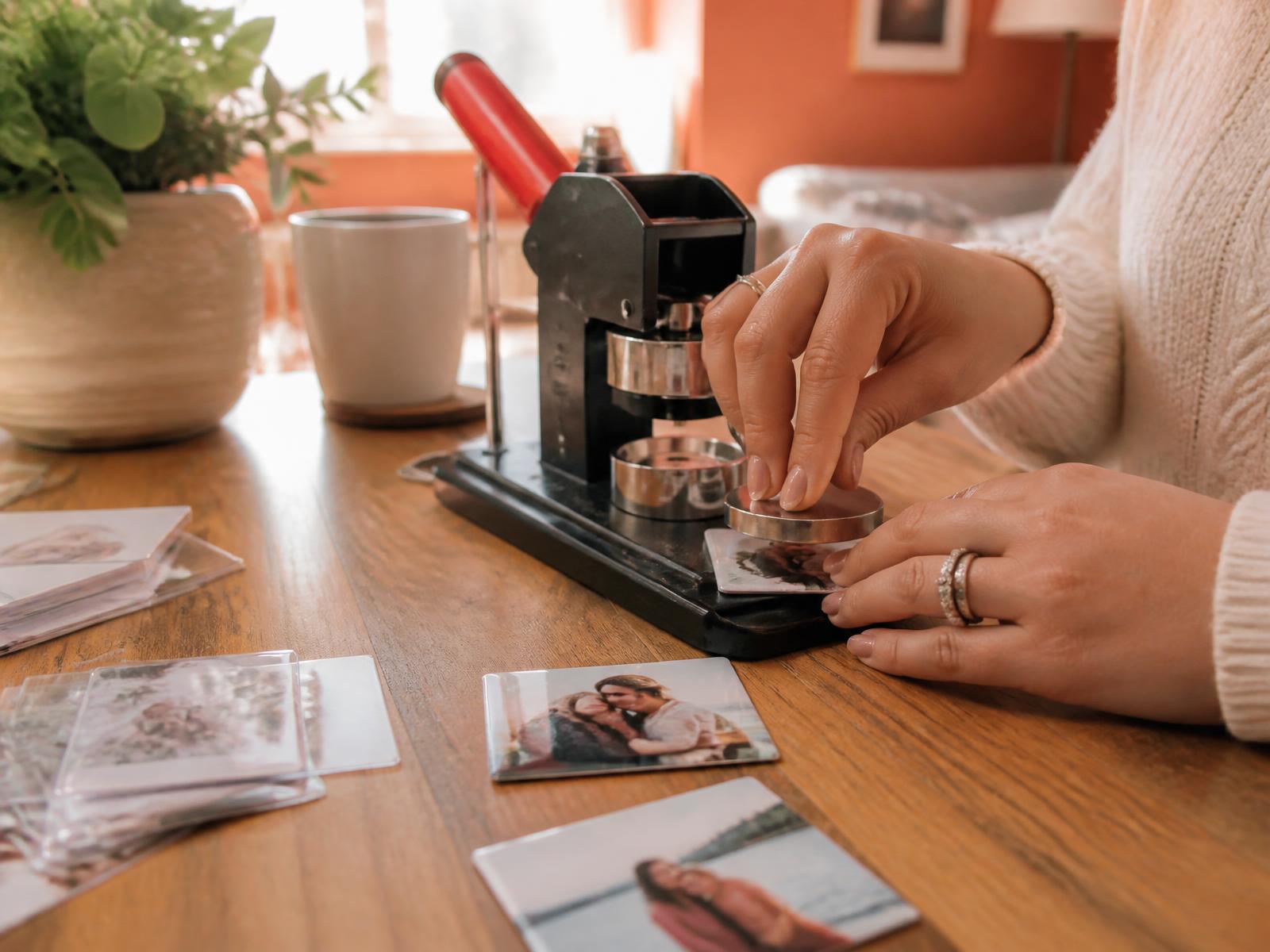 Snapped Memory Magnets booth pressing custom photo magnets at an evening market